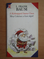Lyman Frank Baum - Mos Craciun a fost rapit (editie bilingva)